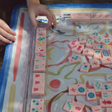 Pink Mahjong tiles from island collection, on the table. Tile size: 1" x 1 7/16" x 7/16".