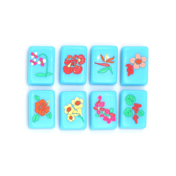 Bright blue Mahjong tiles from island collection featuring flowers. Tile size: 1" x 1 7/16" x 7/16".