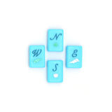 Bright blue Mahjong tiles from island collection featuring winds. Tile size: 1" x 1 7/16" x 7/16".