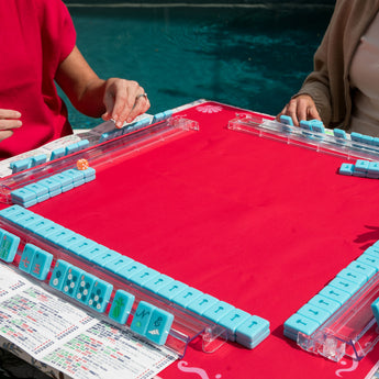 Hot pink Mahjong mat with light pink seashell and ocean-inspired border