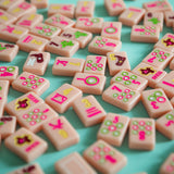 Pink Texas-themed Mahjong tiles featuring Western-inspired designs like cowboy boots, wildflowers, and BBQ motifs for playful and bold game night vibes
