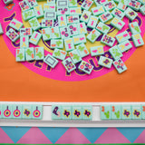 Turquoise Texas-themed Mahjong tiles featuring Western-inspired designs like cowboy boots, wildflowers, and BBQ motifs for playful and bold game night vibes