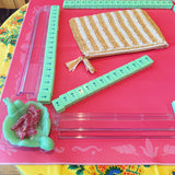 Green mahjong tiles on a pink Mahjong mat with light pink seashell and ocean-inspired border