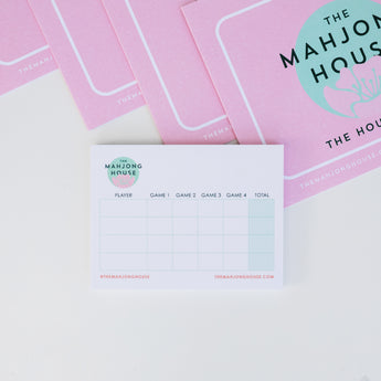 The Mahjong House branded pink card set with matching score pad for Mahjong players.