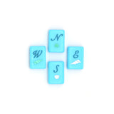 Bright blue Mahjong tiles from island collection featuring winds. Tile size: 1" x 1 7/16" x 7/16". 