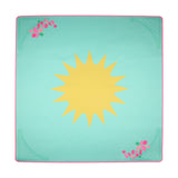 Turquoise Mahjong mat with a large yellow sun in the center and pink floral corner details