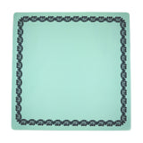 Green Mahjong mat with a floral border design
