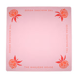 Coral Mahjong mat with blue peony corner details and “The Mahjong House” logo