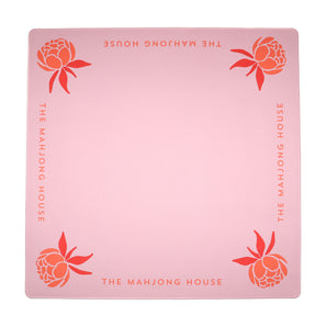Coral Mahjong mat with blue peony corner details and “The Mahjong House” logo