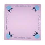 Lavender Mahjong mat with blue peony corner details and “The Mahjong House” logo