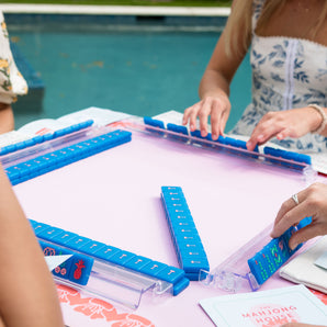 Mahjong lessons in progress with players learning tiles