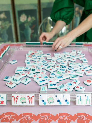 Green Mahjong tile set from the House Collection, featuring intricately designed tiles with floral motifs, butterflies, and peacocks. Tile size: 1" x 1 7/16" x 7/16". 