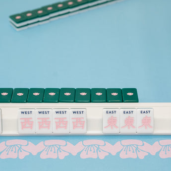 Green Mahjong tile set from the House Collection, featuring intricately designed tiles with floral motifs, butterflies, and peacocks. Tile size: 1" x 1 7/16" x 7/16". 