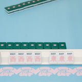 Green Mahjong tile set from the House Collection, featuring intricately designed tiles with floral motifs, butterflies, and peacocks. Tile size: 1" x 1 7/16" x 7/16". 