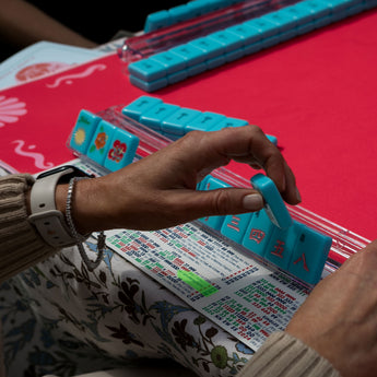 Hot pink Mahjong mat with light pink seashell and ocean-inspired border