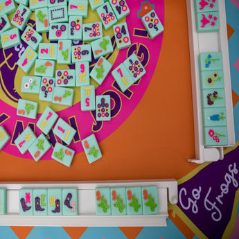 Colorful TCU Mahjong mat with cowboy boots, gators, and “Go Frogs” pennants in bold purple, pink, orange, and blue