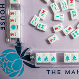 Lavender Mahjong mat with blue peony corner details and “The Mahjong House” logo