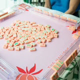 Coral Mahjong mat with blue peony corner details and “The Mahjong House” logo