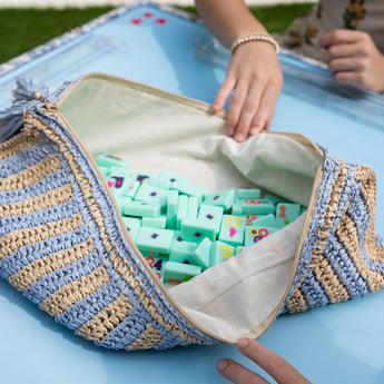 A Mahjong travel bag on a blue Mahjong mat