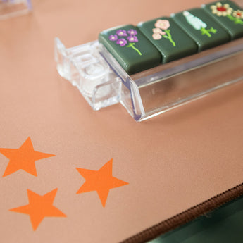 Brown Mahjong mat with orange stars in two corners