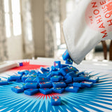 Mahjong mat with bold red, white, and blue starburst design