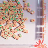 Coral Mahjong mat with blue peony corner details and “The Mahjong House” logo