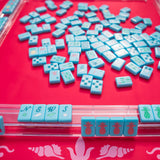 Hot pink Mahjong mat with light pink seashell and ocean-inspired border