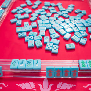 Hot pink Mahjong mat with light pink seashell and ocean-inspired border