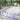 Lavender Mahjong mat with blue peony corner details and “The Mahjong House” logo