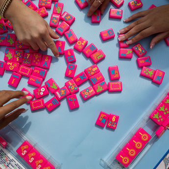 Hot pink Texas-themed Mahjong tiles featuring Western-inspired designs like cowboy boots, wildflowers, and BBQ motifs for playful and bold game night vibes