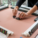 Olive Texas-themed Mahjong tiles featuring Western-inspired designs like cowboy boots, wildflowers, and BBQ motifs for playful and bold game night vibes